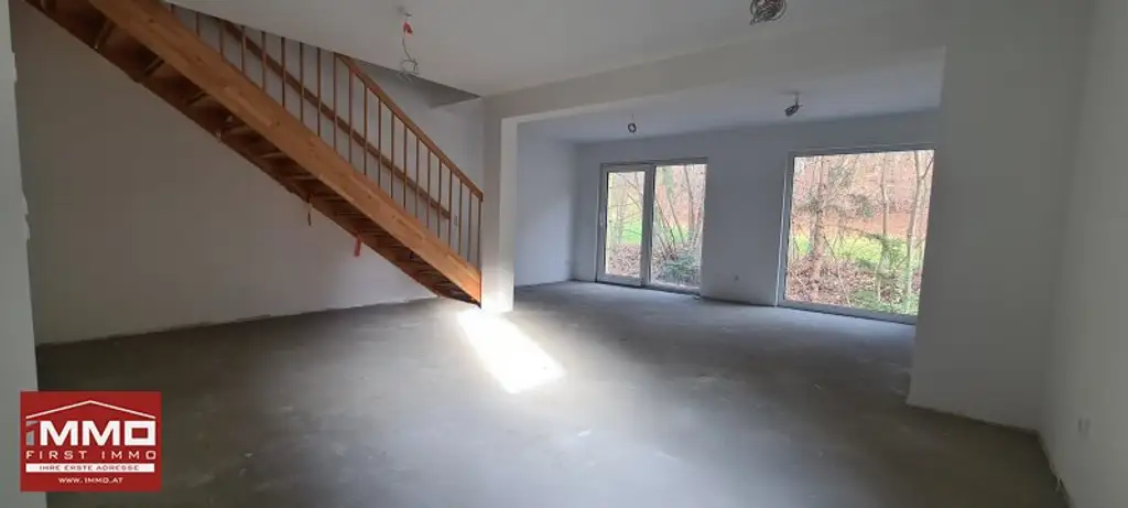 ***ERSTBEZUGS-DOPPELHAUSHÄLFTE DIREKT AM WASSER MIT SÜD-GARTEN!***