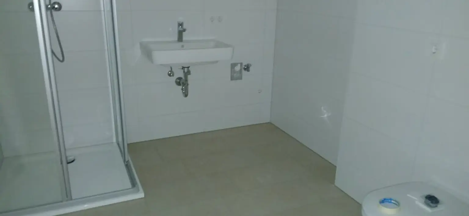 NEUBAU - ERSTBEZUG - Top 5 - Wunderschöne 2 Zimmerwohnung mit Terrasse, kleinem Garten und eigenem Tiefgaragenplatz