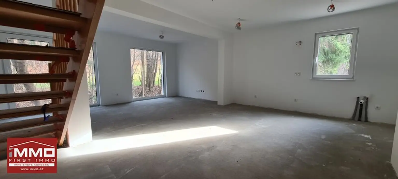 ***ERSTBEZUGS-DOPPELHAUSHÄLFTE DIREKT AM WASSER MIT SÜD-GARTEN!***