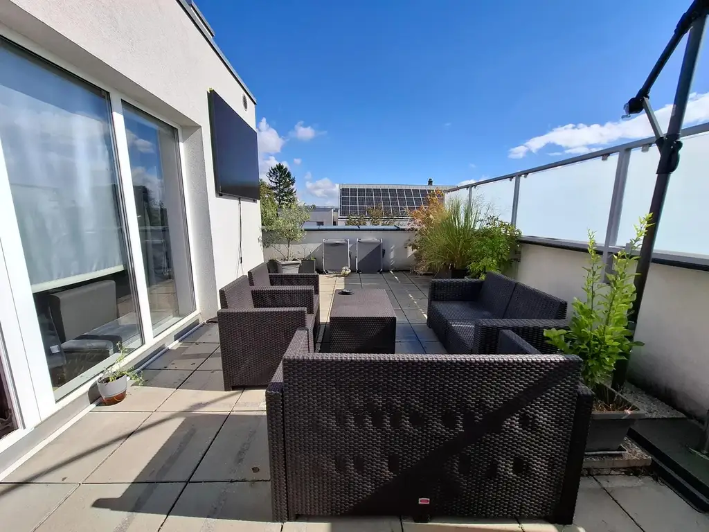 Moderne Eigentumswohnung mit 28 m² Dachterrasse in bester Lage