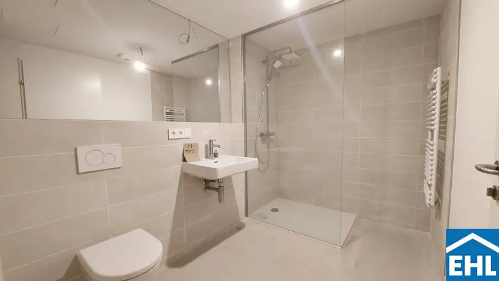 1,5-Zi.-Erstbezug mit Loggia & Rooftop Spa | TOWER HOMES im V22