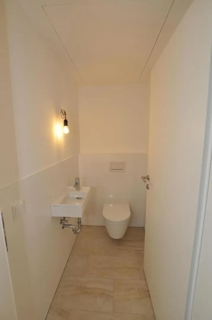 Moderne, sonnige Erdgeschoßwohnung mit Eigengarten und Tiefgarage