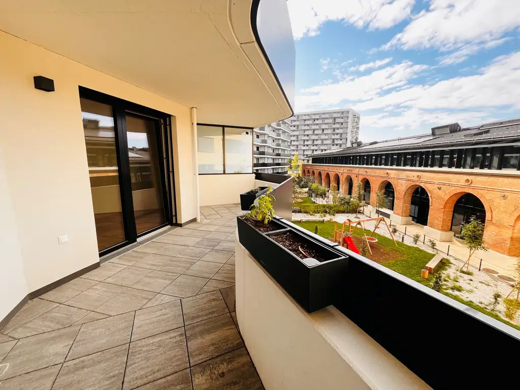 EXKLUSIVER ERSTBEZUG nahe Hauptbahnhof - Sonnige Wohnung mit großzügiger Freifläche und Küche in einem modernen Neubauprojekt