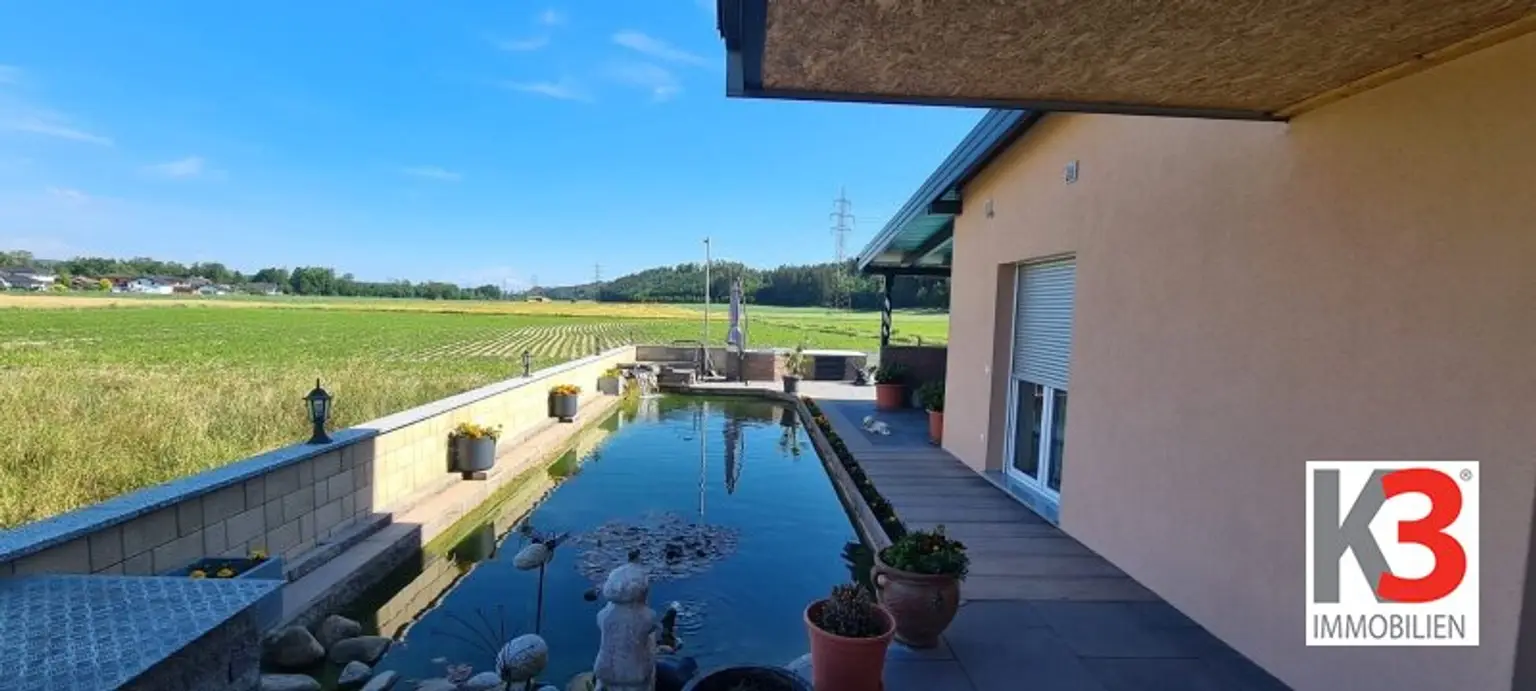 K3 präsentiert Wohnung mit Pool, Teich, Einliegerwohnung und Doppelcarport in absoluter Ruhelage