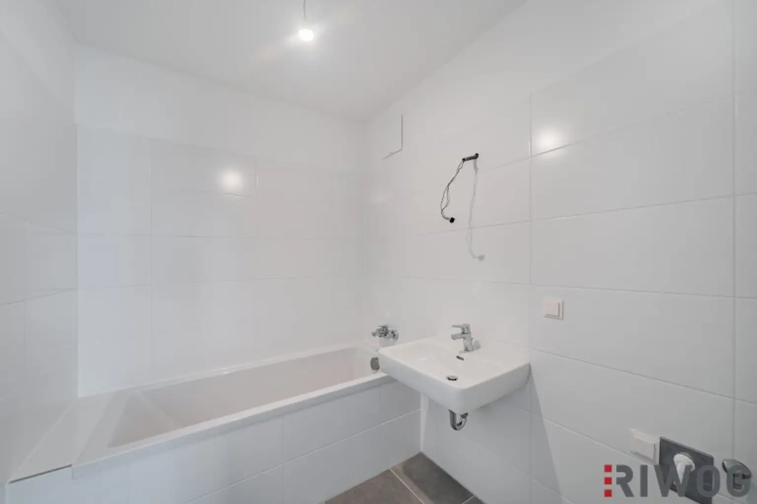 Erstbezug nach Neuerrichtung - Moderne 2-Zimmer-Wohnung mit großem Eigengarten