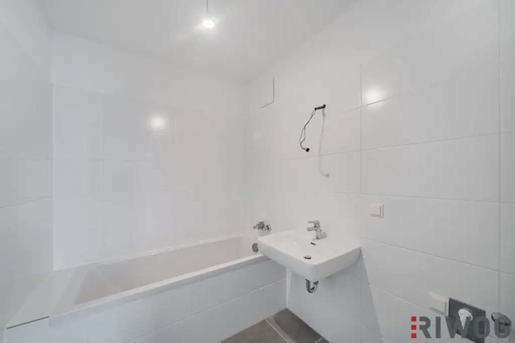Erstbezug nach Neuerrichtung - Moderne 2-Zimmer-Wohnung mit großem Eigengarten