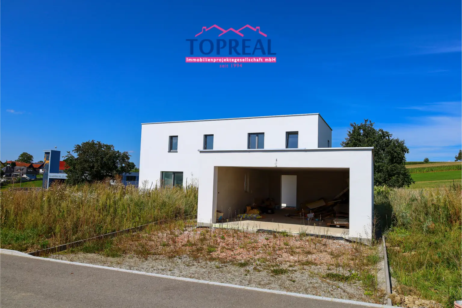 Neubau-Einfamilienhaus in St. Roman – modernes Wohnen mit offenem Design & Südwestgarten