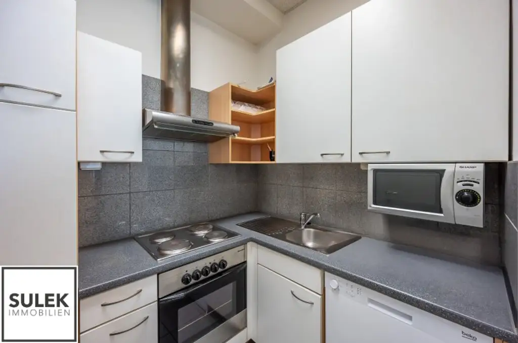 Grundstück mit vier Baukörpern - Büro-, Geschäfts- und Gewerbegebäude inkl. Parkplätzen in Vösendorf