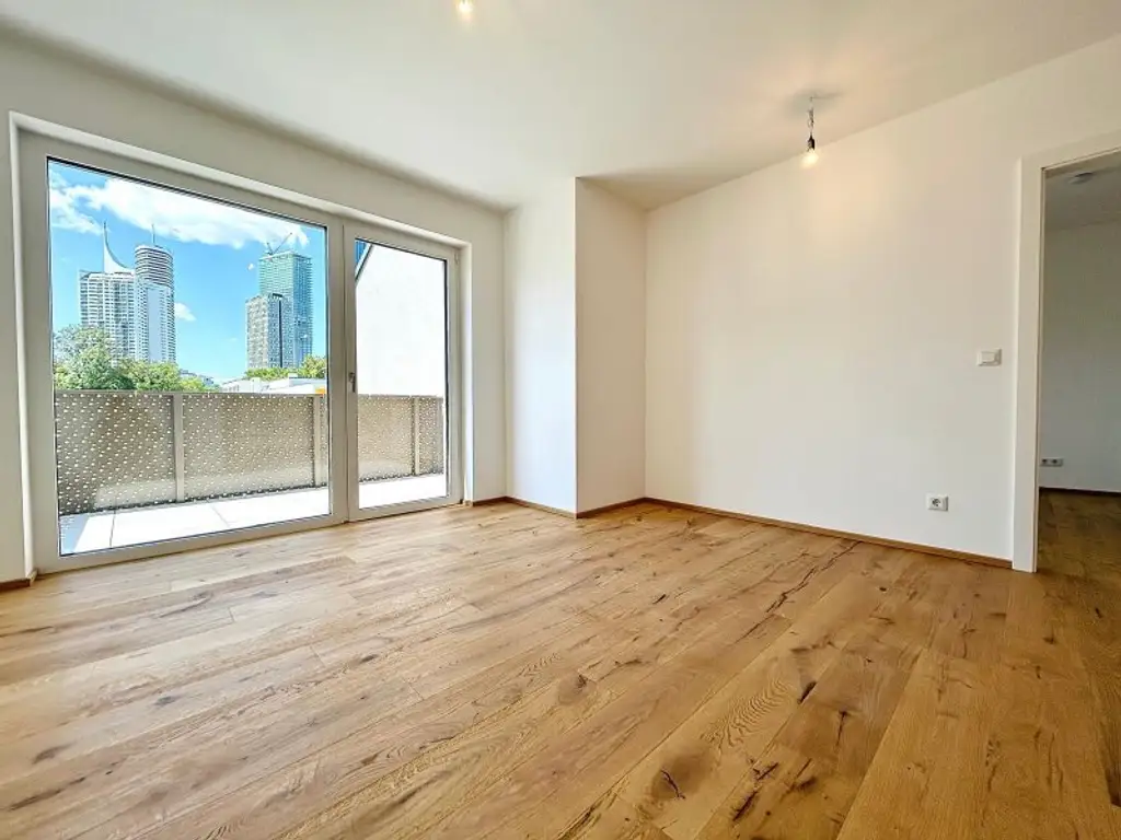 Provisionsfreie, klimatisierte Dachgeschosswohnung nahe der UNO-City – 2 Terrassen, Fitnessraum, PKW-Stellplatz – Erstbezug