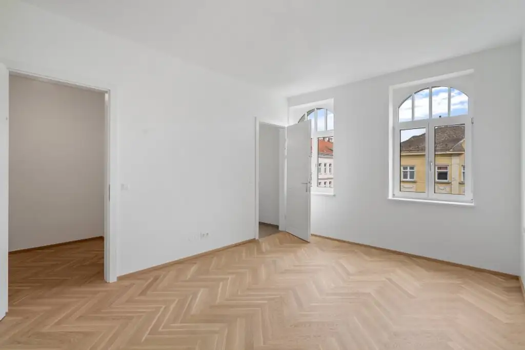 4-Zimmer-Altbaueigentumswohnung in generalsaniertem Altbau mit Balkon