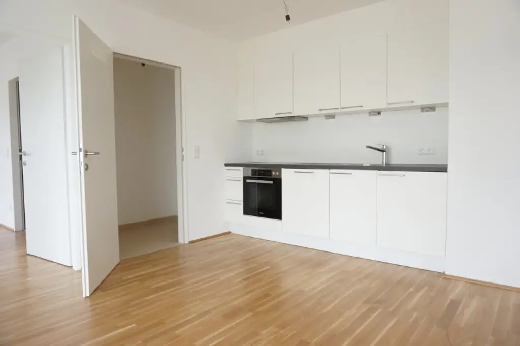 UNO - U1 Am Kaisermühlendamm  - Neubau mit großem Balkon und Garage - Mietbeginn ab 15. November 2025 | New 1BR apartment with Garage - start of lease 15/11/2025