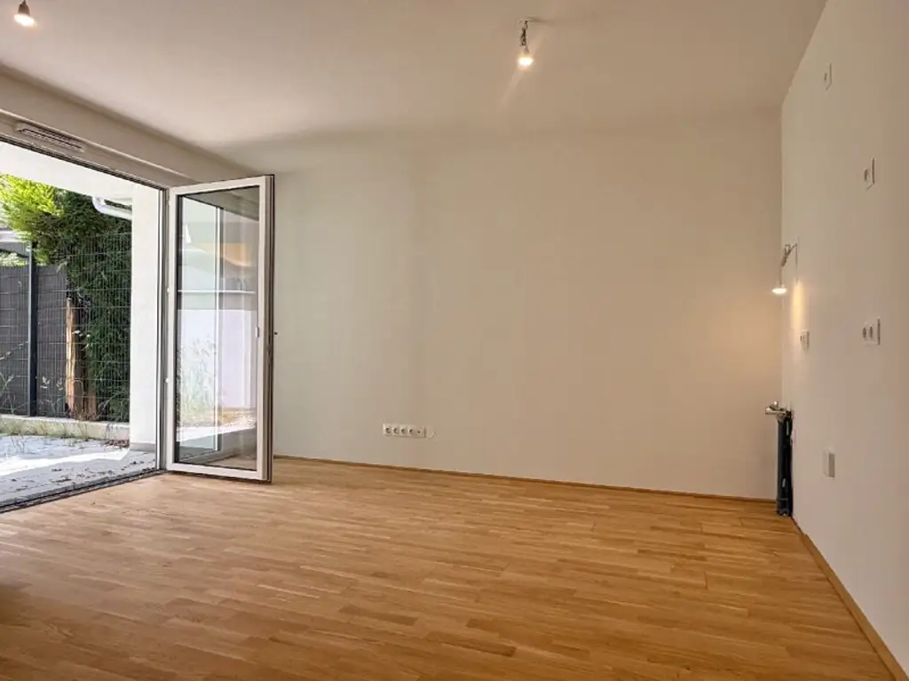 Gartenwohnung - ERSTBEZUG I  ca. 33m² Außenfläche I Maßküche I Tiefgarage I Donau-Nähe I Fußbodenheizung I Fernwärme I