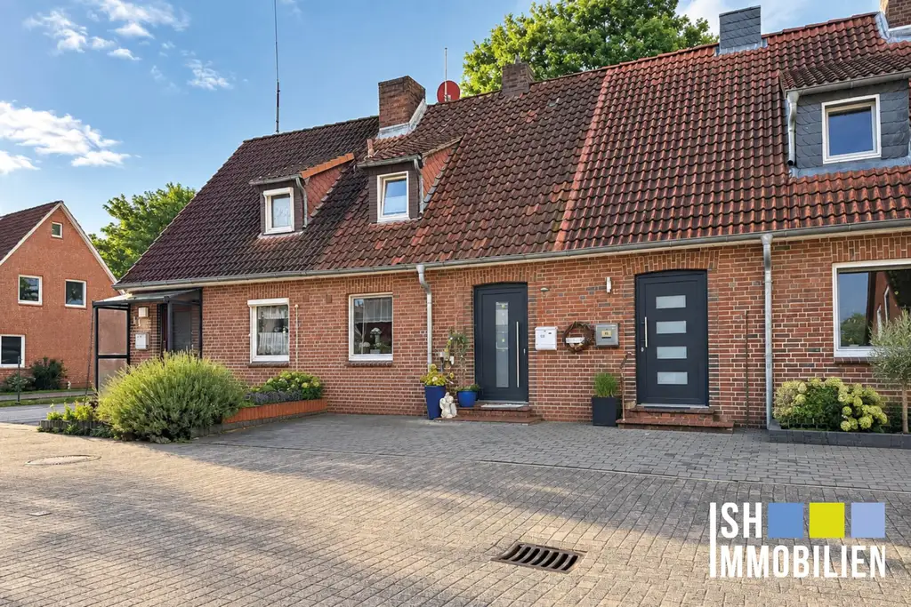 Gut vermietetes Mittelreihenhaus mit Kamin und Garten zu verkaufen!