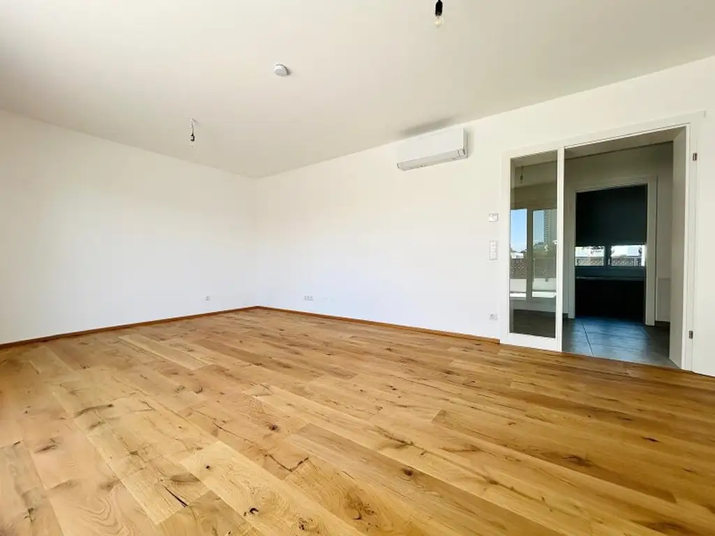 Provisionsfreie, klimatisierte Dachgeschosswohnung nahe der UNO-City – 2 Terrassen, Fitnessraum, PKW-Stellplatz – Erstbezug