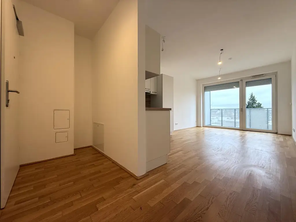Günstige Neubauwohnung mit MEGA-SÜD-BALKON (11,77m²) nahe Akademiepark