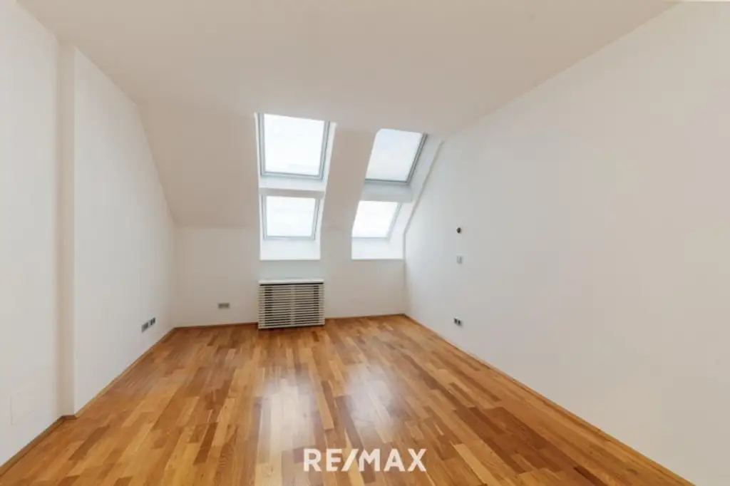 Altbau trifft Moderne – Wohnen über den Dächern