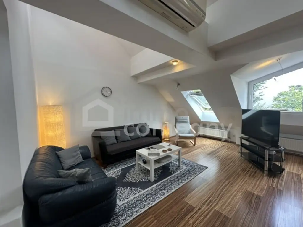 Dachgeschosswohnung in 1040 Wien – modern, geräumig, mit Balkon!