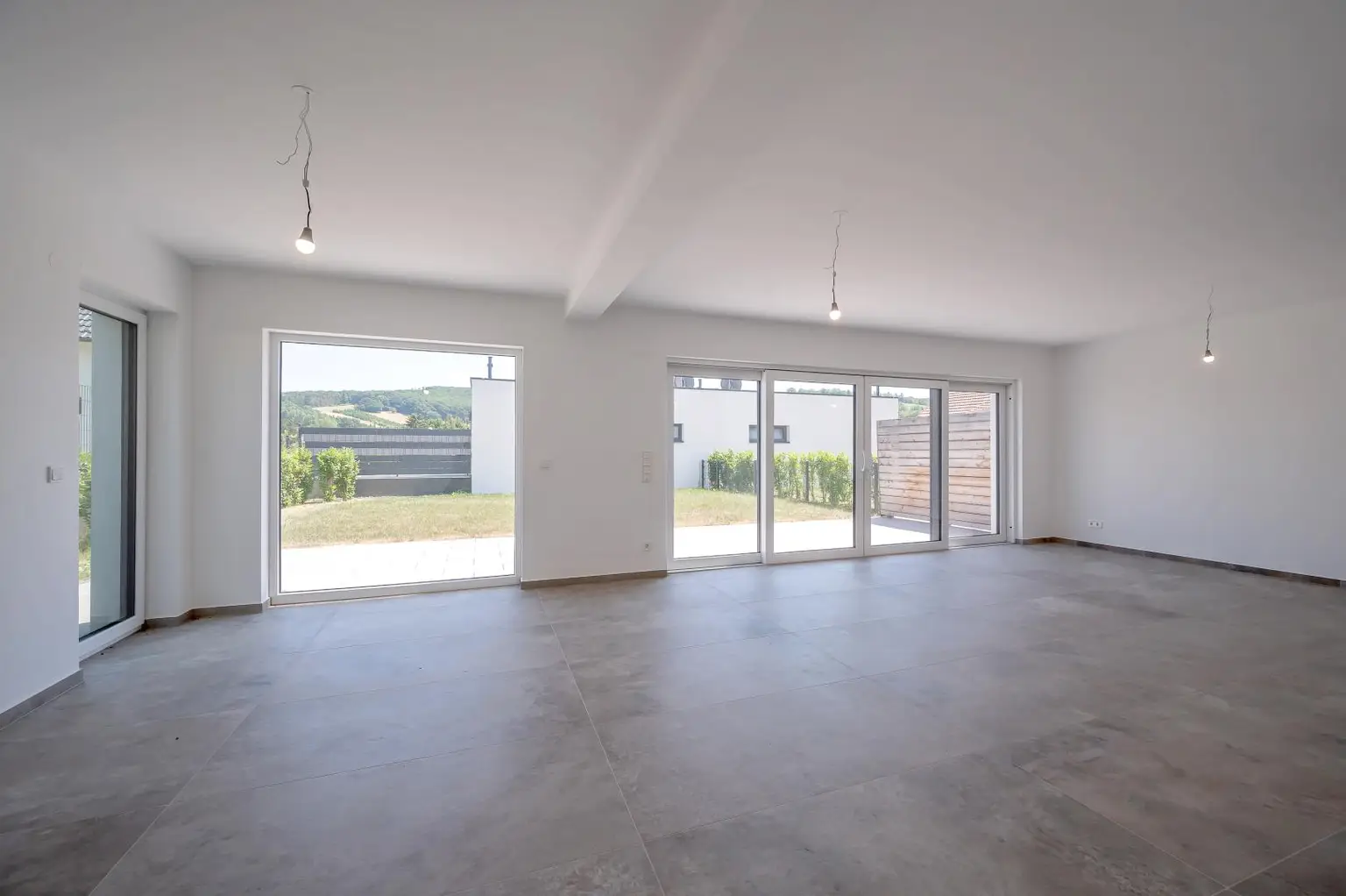 Erstbezug: Großzügiger Familientraum mit unverbaubarem Grünblick!