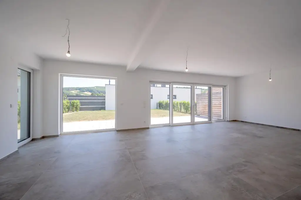 Erstbezug: Großzügiger Familientraum mit unverbaubarem Grünblick!
