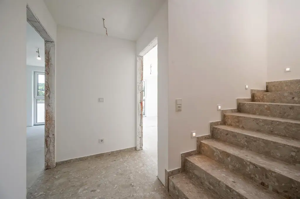 Erstbezug: Großzügiger Familientraum mit unverbaubarem Grünblick!