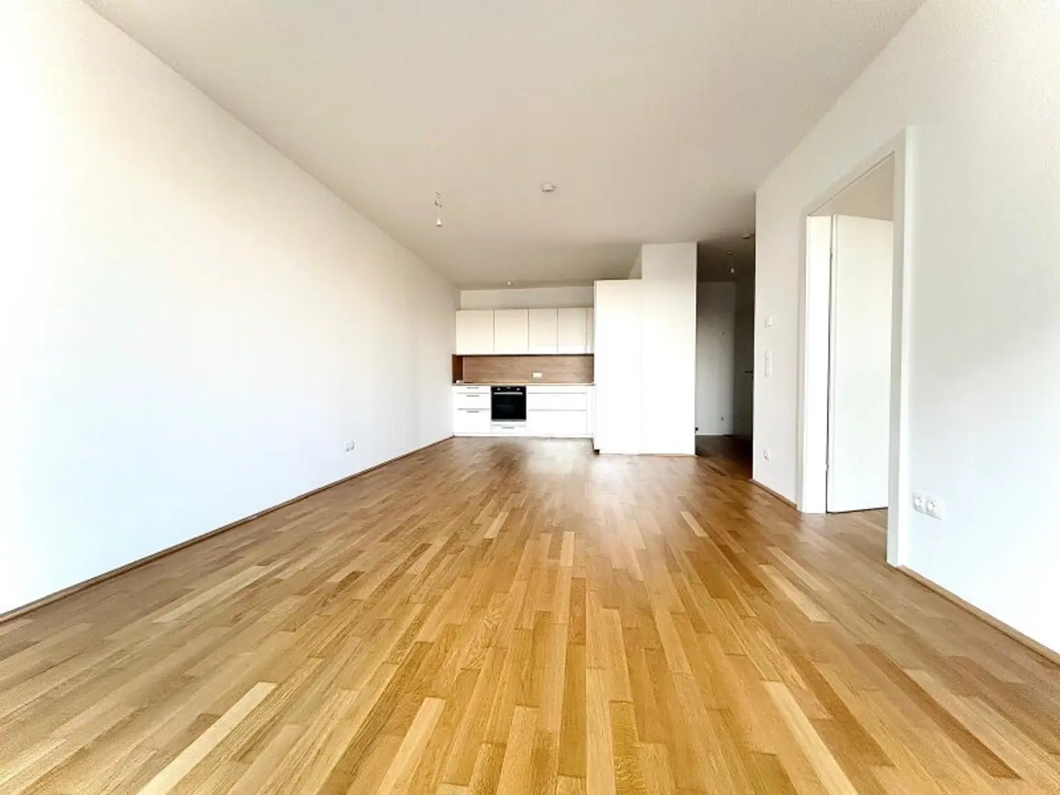 Modernes Neubau Refugium mit Grünblick & exklusiver Hausanlage | Partyraum | Fitnessraum