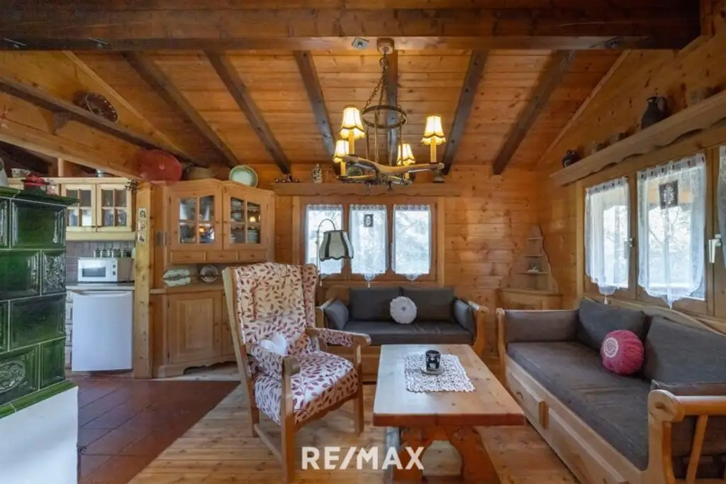 „Wohnen im Einklang mit der Natur – Stilvolles Holzhaus in traumhafter Ruhelage auf unverbaubarem Grundstück“