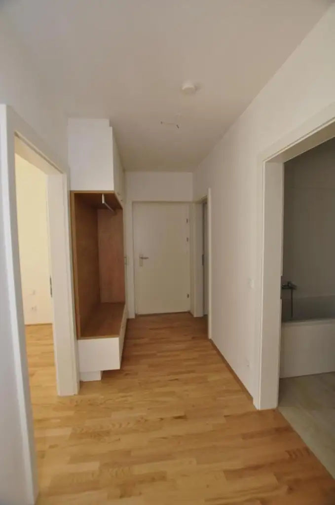 Moderne, sonnige Erdgeschoßwohnung mit Eigengarten und Tiefgarage