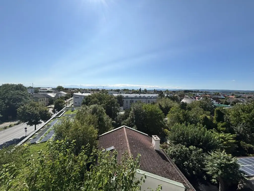 Exklusive Erstbezugs-Dachgeschosswohnung mit Loggia & Seeblick in zentraler Lage von Neusiedl