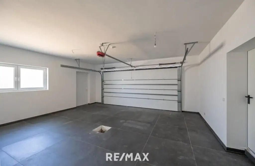 Erstbezug: Großzügiger Familientraum mit unverbaubarem Grünblick!