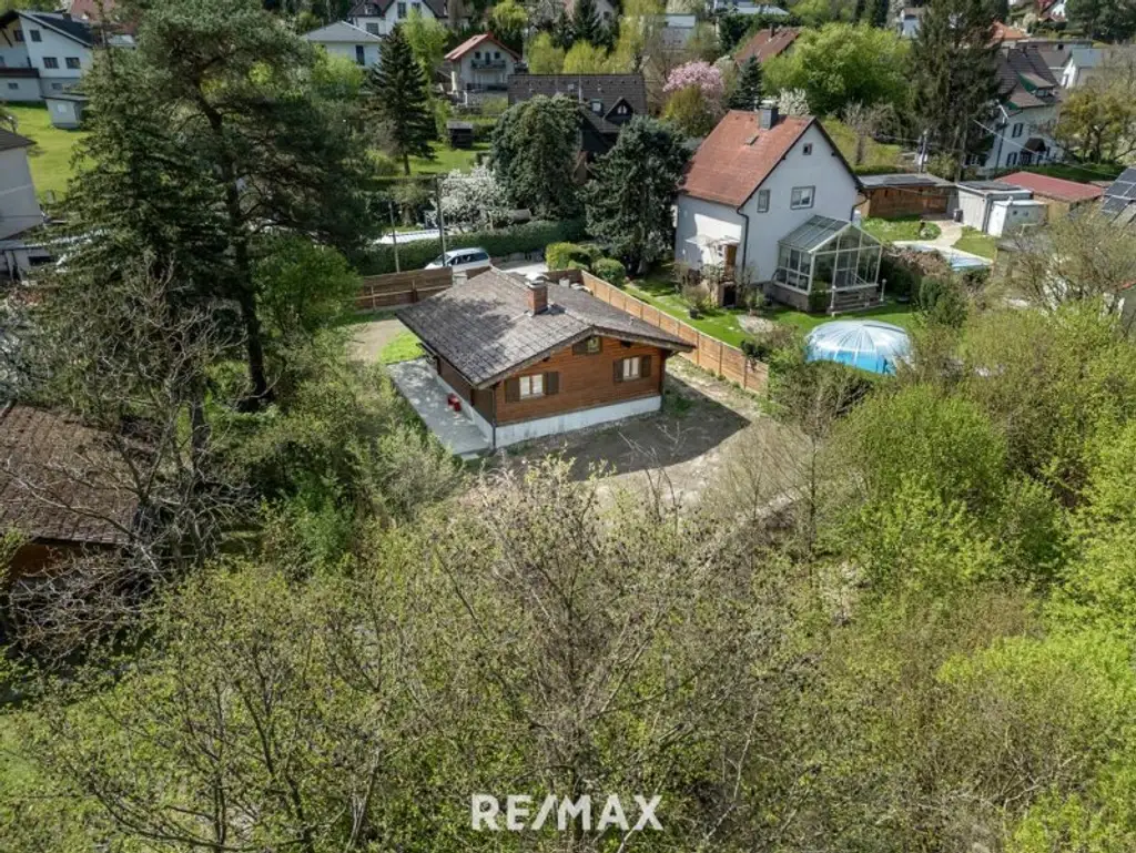„Wohnen im Einklang mit der Natur – Stilvolles Holzhaus in traumhafter Ruhelage auf unverbaubarem Grundstück“