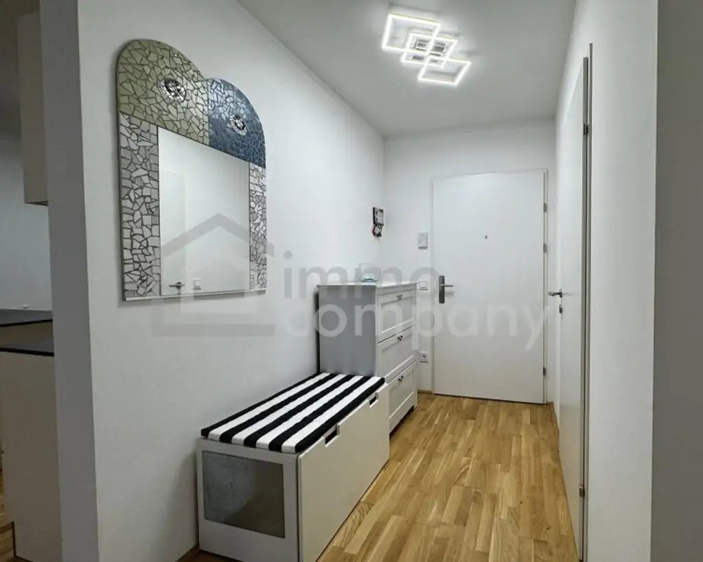 Neubau-3-Zimmer mit 14 m²-Balkon, Tiefgarage & Blick auf den Wienerberg