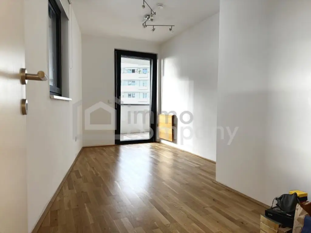 Neubau-3-Zimmer mit 14 m²-Balkon, Tiefgarage & Blick auf den Wienerberg
