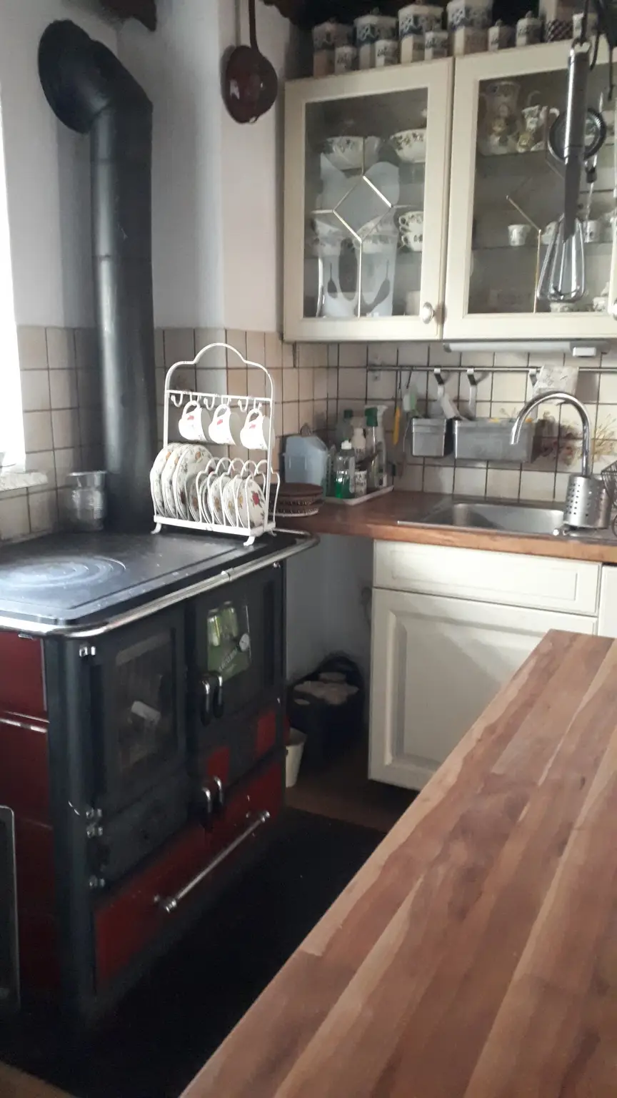 Küche mit rustikalem Ofen