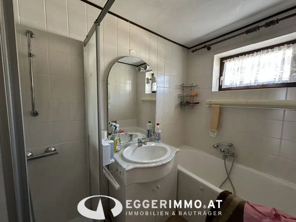 Niedernsill - Spacious 4-Room Apartment with Garden & Balcony for Sale in a Two-Party House