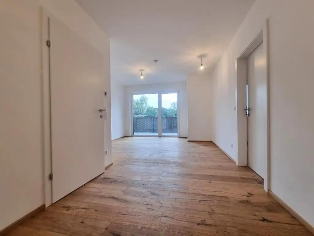 Provisionsfrei! Erstbezug nahe der UNO-City – Traumhafte Wohnung mit Freifläche · inkl. Küche