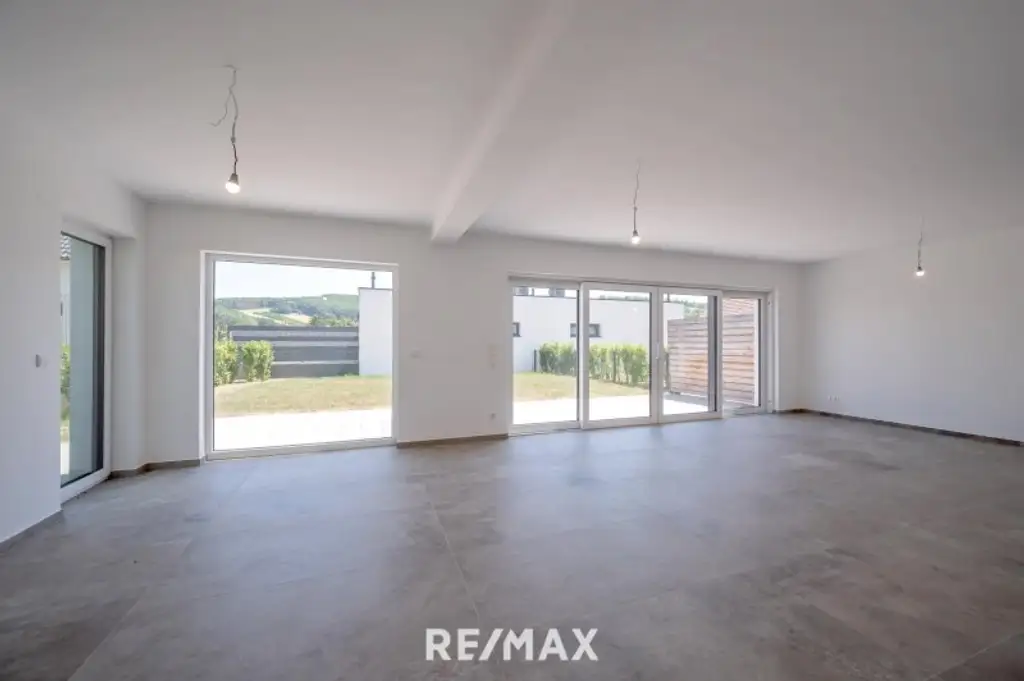 Erstbezug: Großzügiger Familientraum mit unverbaubarem Grünblick!