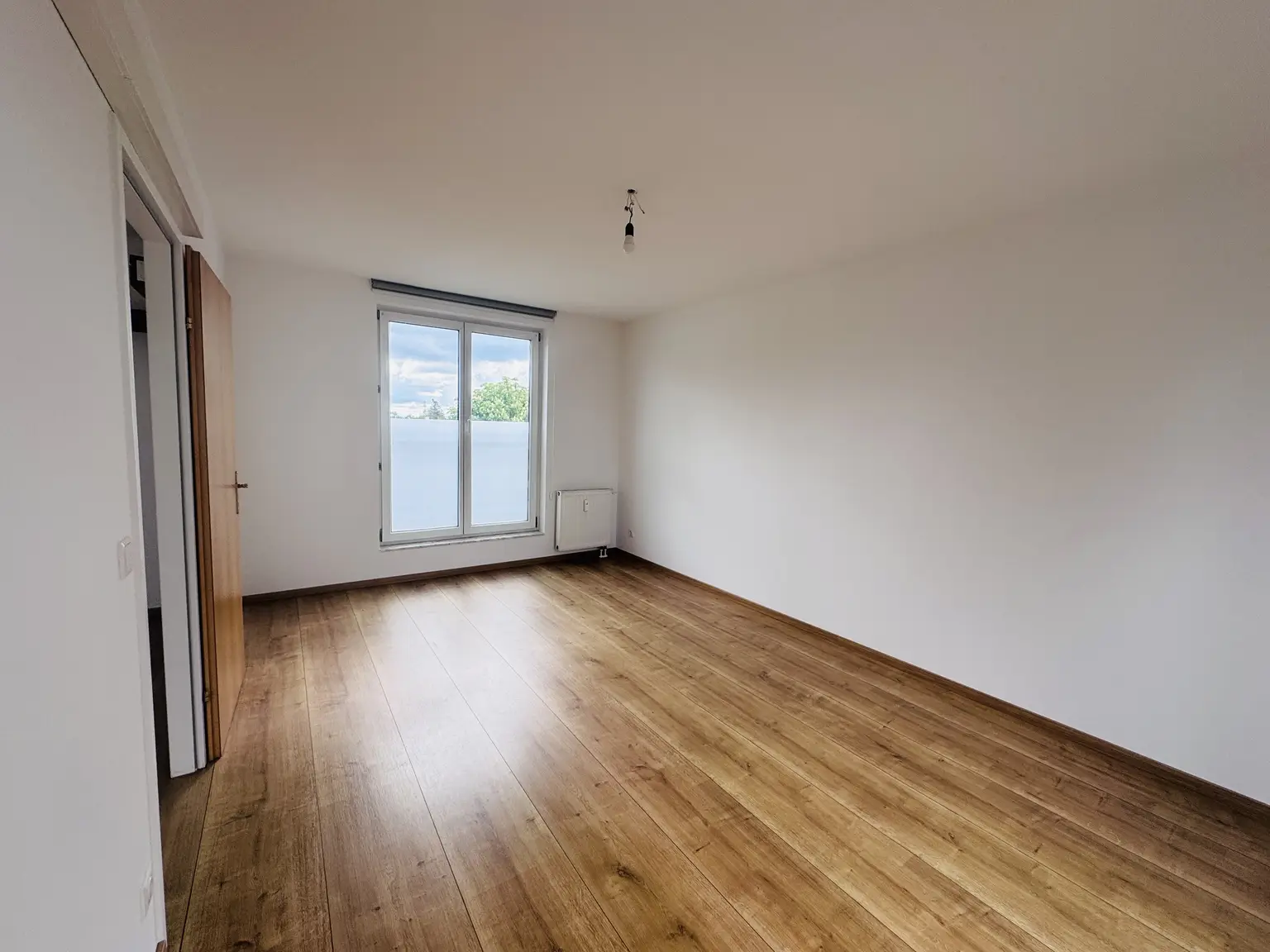 3-Zimmer-Neubauwohnung mit Westbalkon & Garage in ruhiger Grünlage