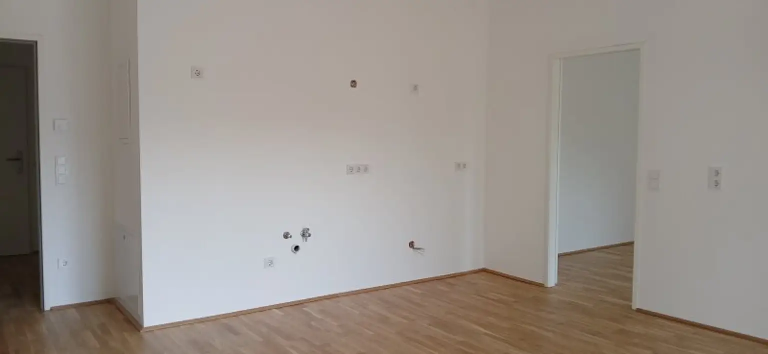 NEUBAU - ERSTBEZUG - Top 5 - Wunderschöne 2 Zimmerwohnung mit Terrasse, kleinem Garten und eigenem Tiefgaragenplatz