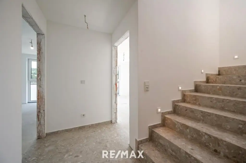 Erstbezug: Großzügiger Familientraum mit unverbaubarem Grünblick!