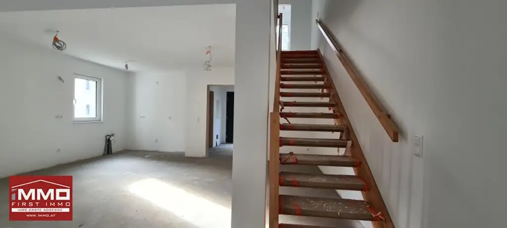 ***ERSTBEZUGS-DOPPELHAUSHÄLFTE DIREKT AM WASSER MIT SÜD-GARTEN!***