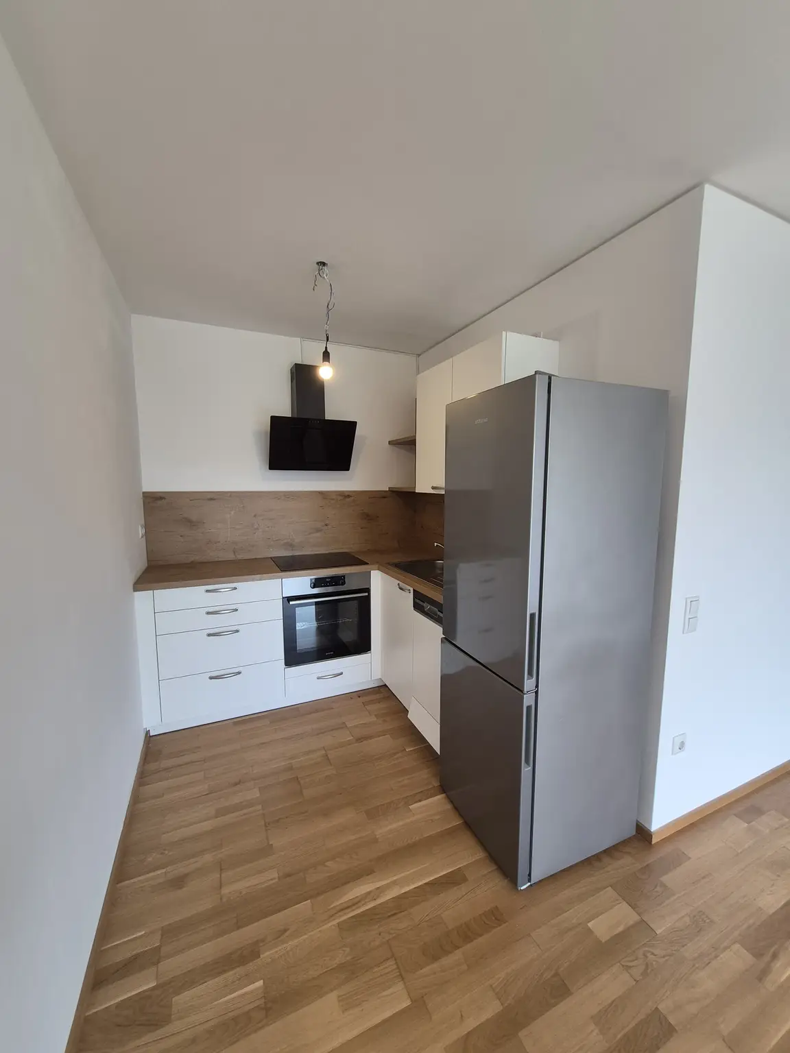 Neubau: Besonders ansprechende 54 m² 2-Zimmerwohnung mit 28 m² Garten