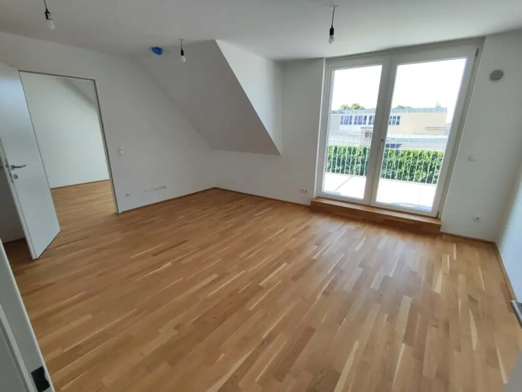NEUBAU DACHGESCHOß-3-Zimmer-ERSTBEZUG mit Balkon in 1210 Wien! Top 2/50