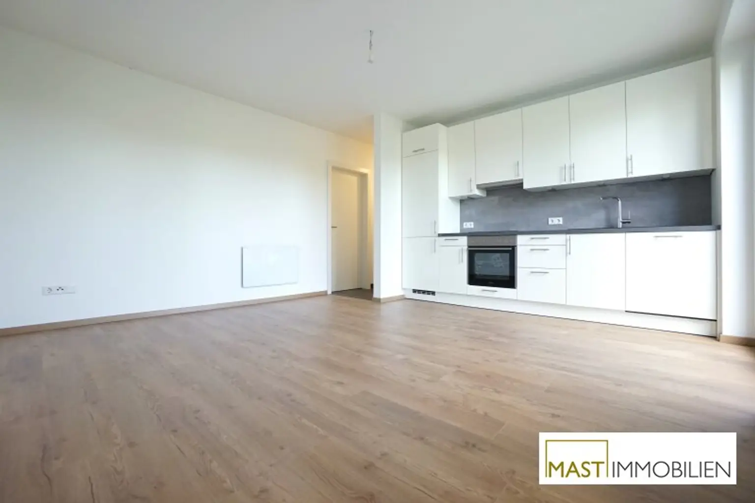 2 Zimmer Garten Wohnung inkl. EWE Einbauküche in optimaler Lage - inkl. PKW Abstellplatz