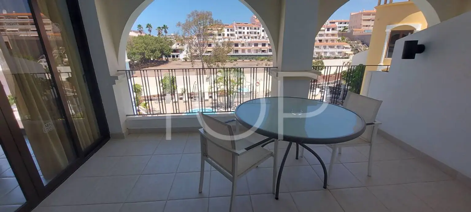 C-4 Kitchen and living room terrace with pool views