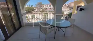 C-4 Kitchen and living room terrace with pool views