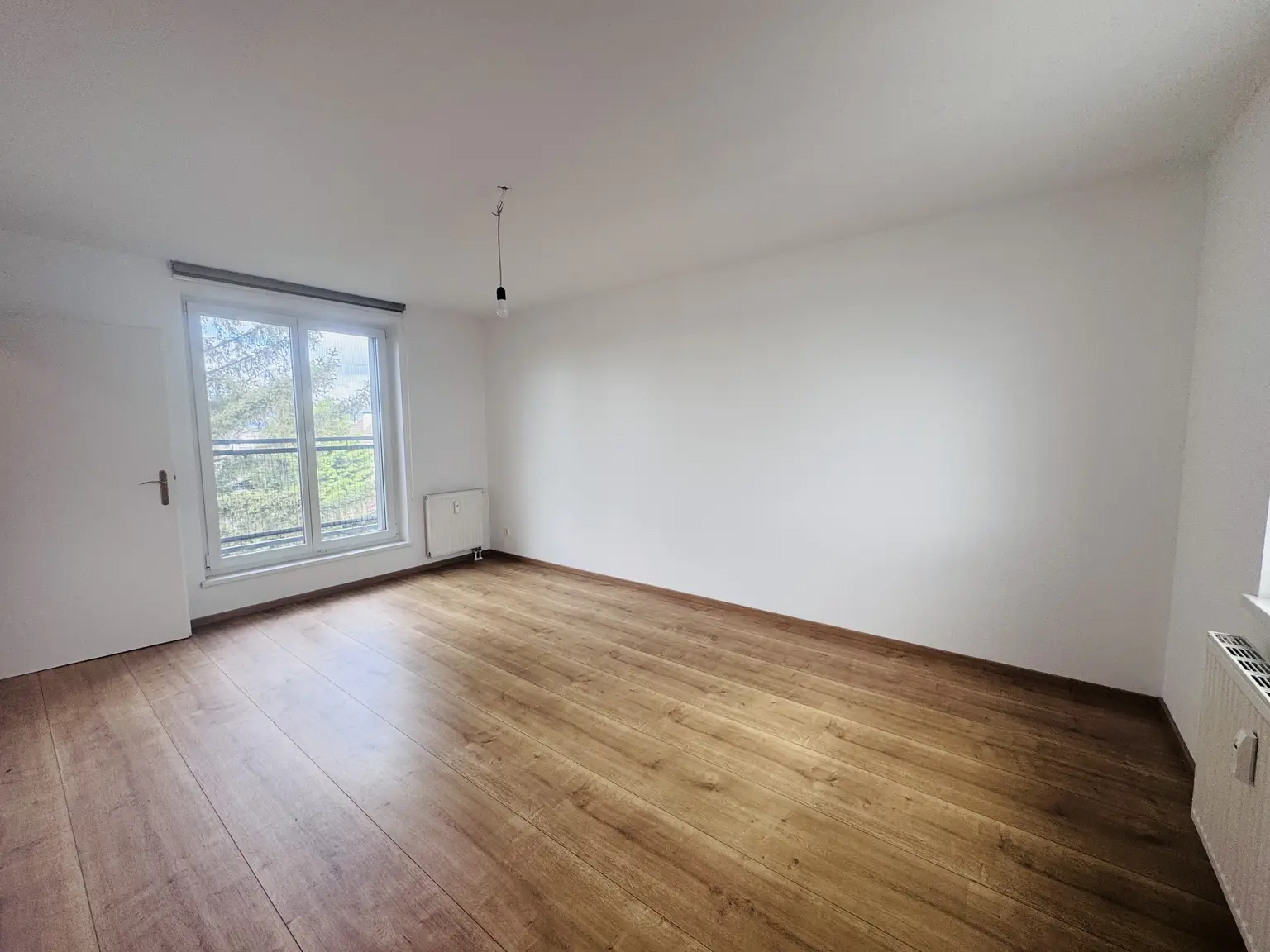 3-Zimmer-Neubauwohnung mit Westbalkon & Garage in ruhiger Grünlage
