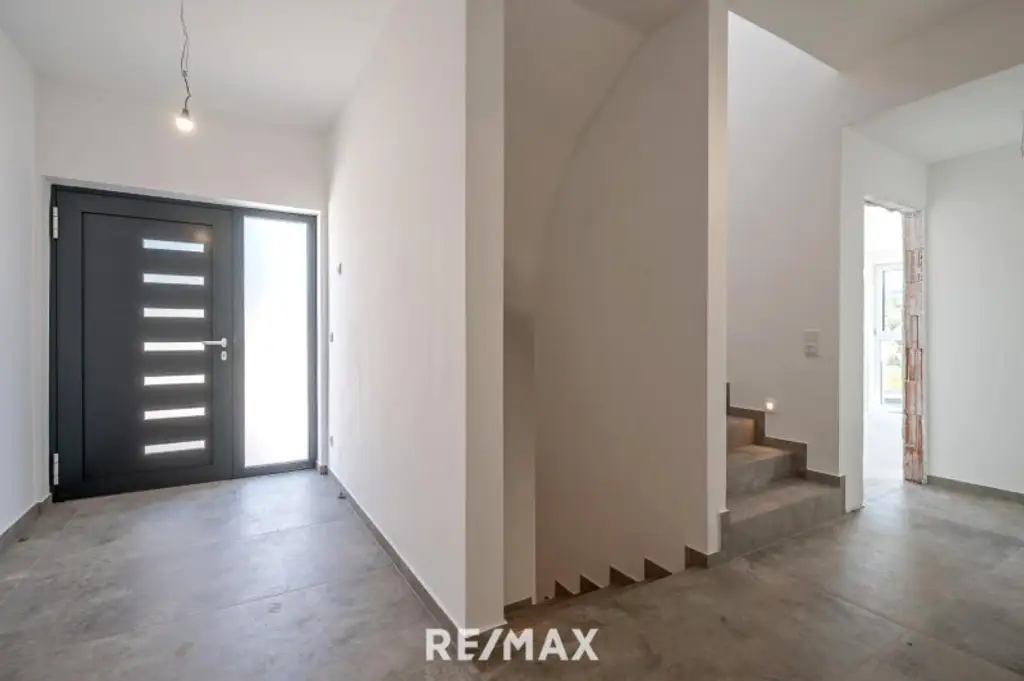 Erstbezug: Großzügiger Familientraum mit unverbaubarem Grünblick!