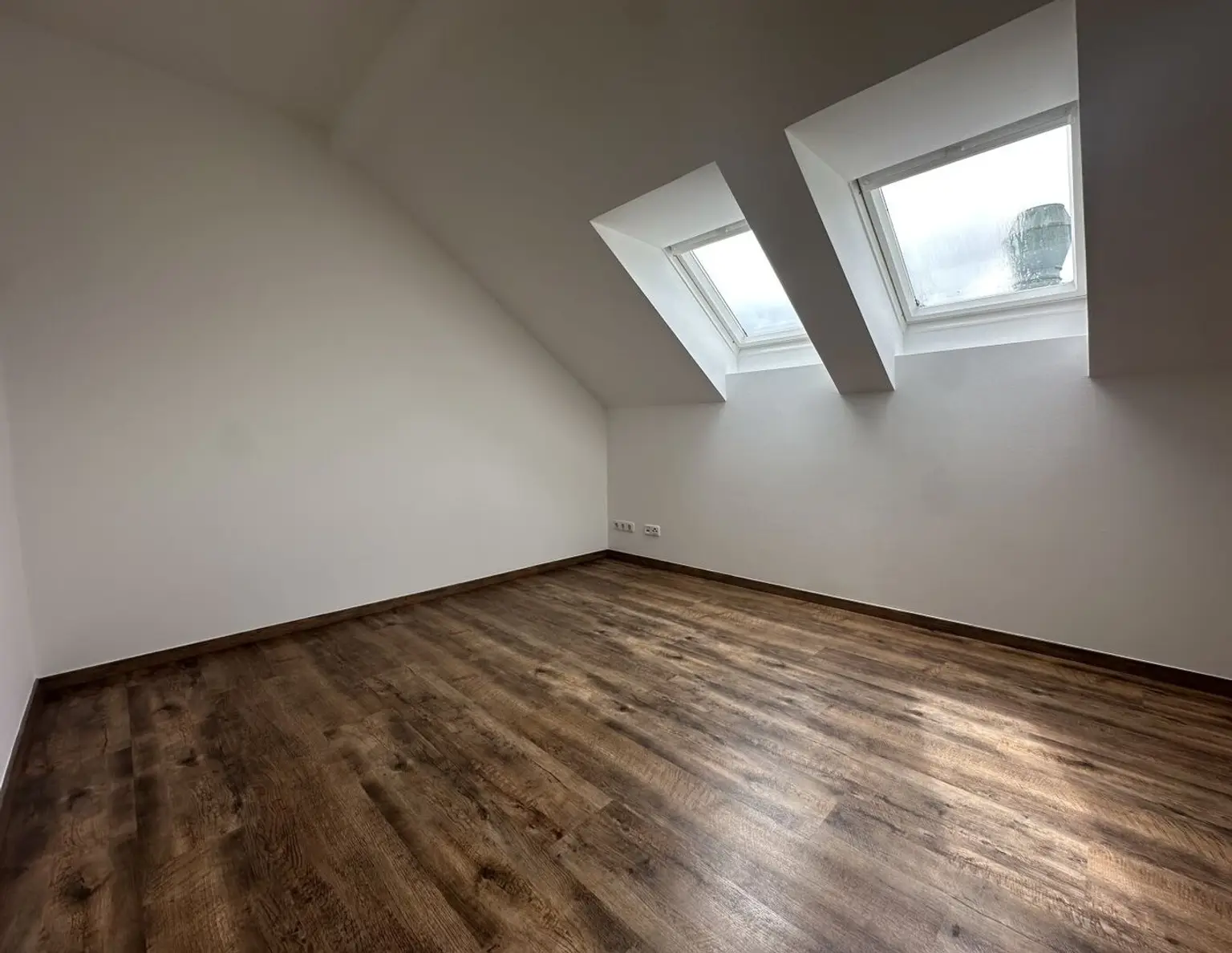 Dachgeschoss trifft Design - wohnen im Herzen von Pettenbach.