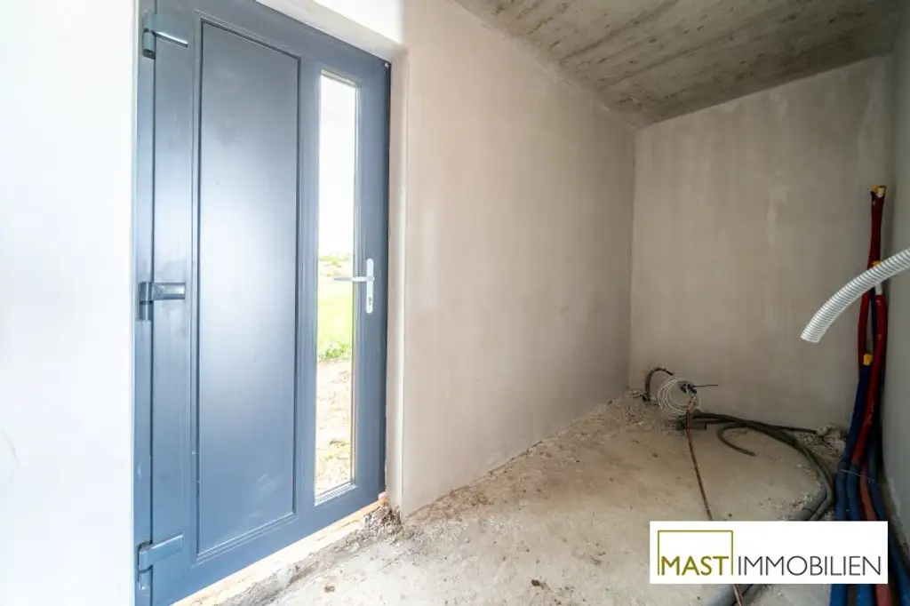 ERSTBEZUG - Modernes Einfamilienhaus mit 148 m² Wohnfläche, Balkon, Terrasse & 2 PKW-Stellplätzen in Strasshof – belagsfertig!
