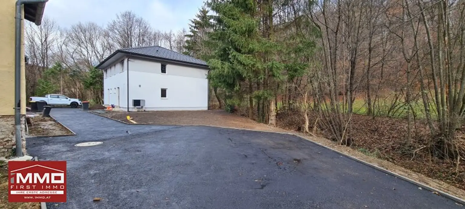 ***ERSTBEZUGS-DOPPELHAUSHÄLFTE DIREKT AM WASSER MIT SÜD-GARTEN!***